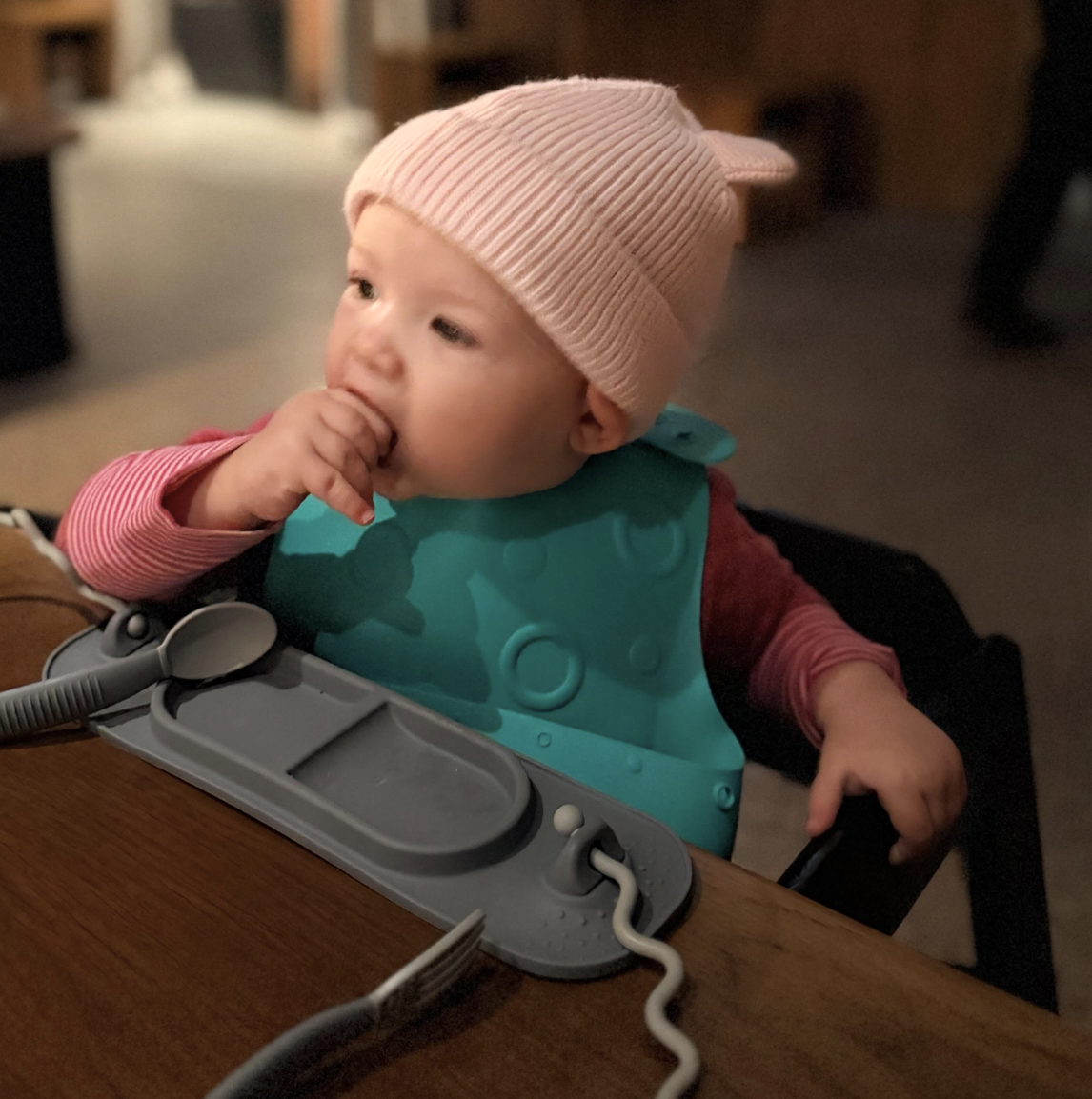 Baby in beanie with Busy Baby mat